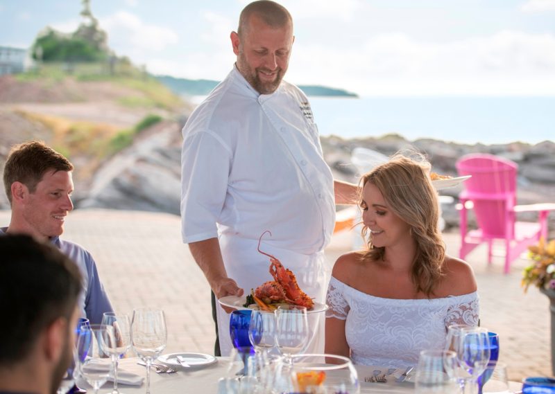 Group dining at Fox harb'r Resort at an outdoor venue